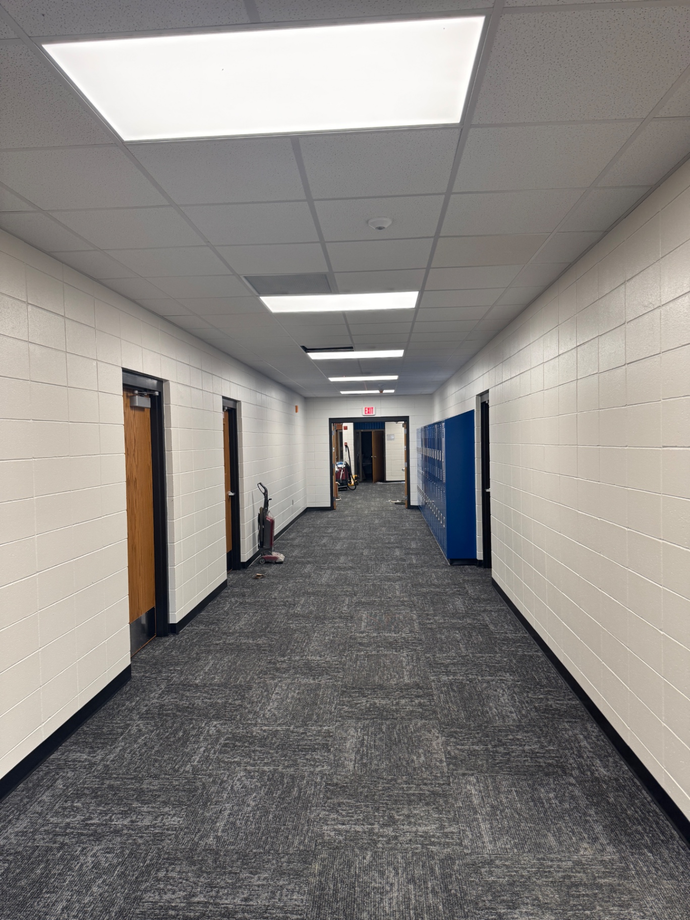 Illuminated hallway with ceiling panel lights