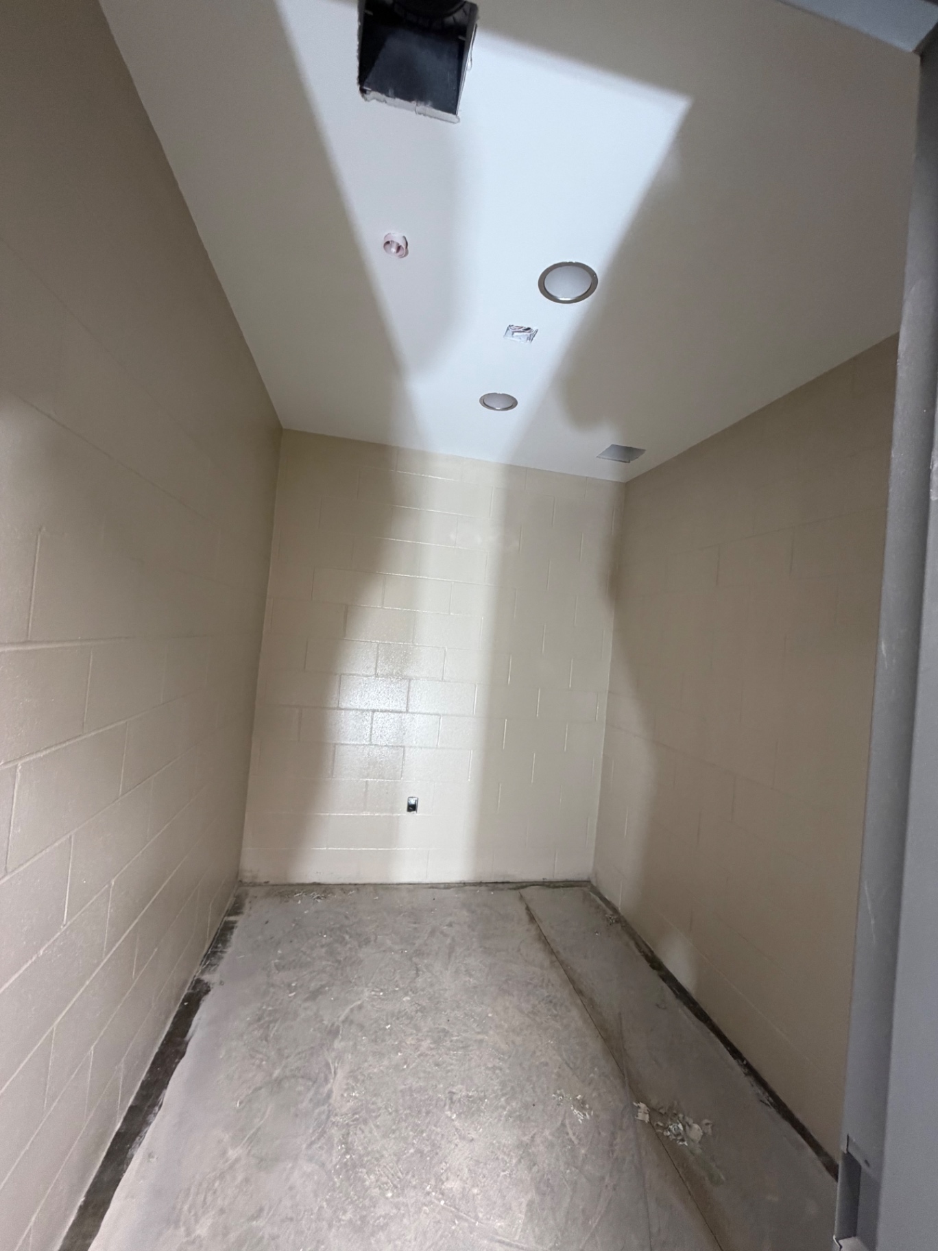 Ceiling lights in a narrow tiled room