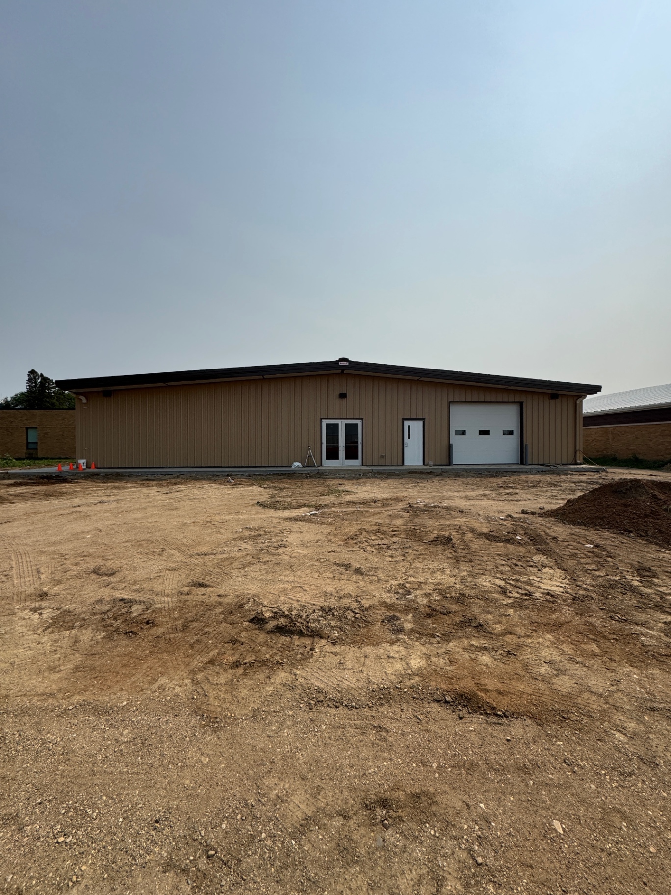 Exterior of a building with overhead and entry doors