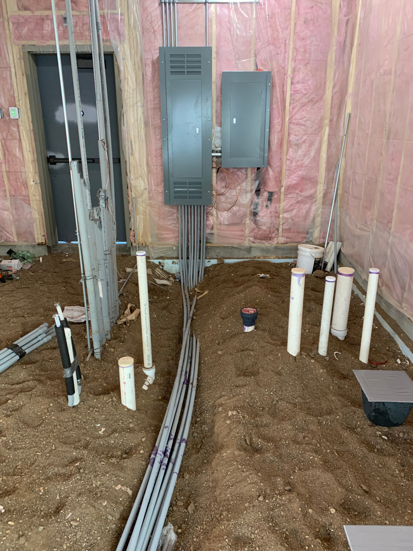 Electrical panels and conduit in a home under construction