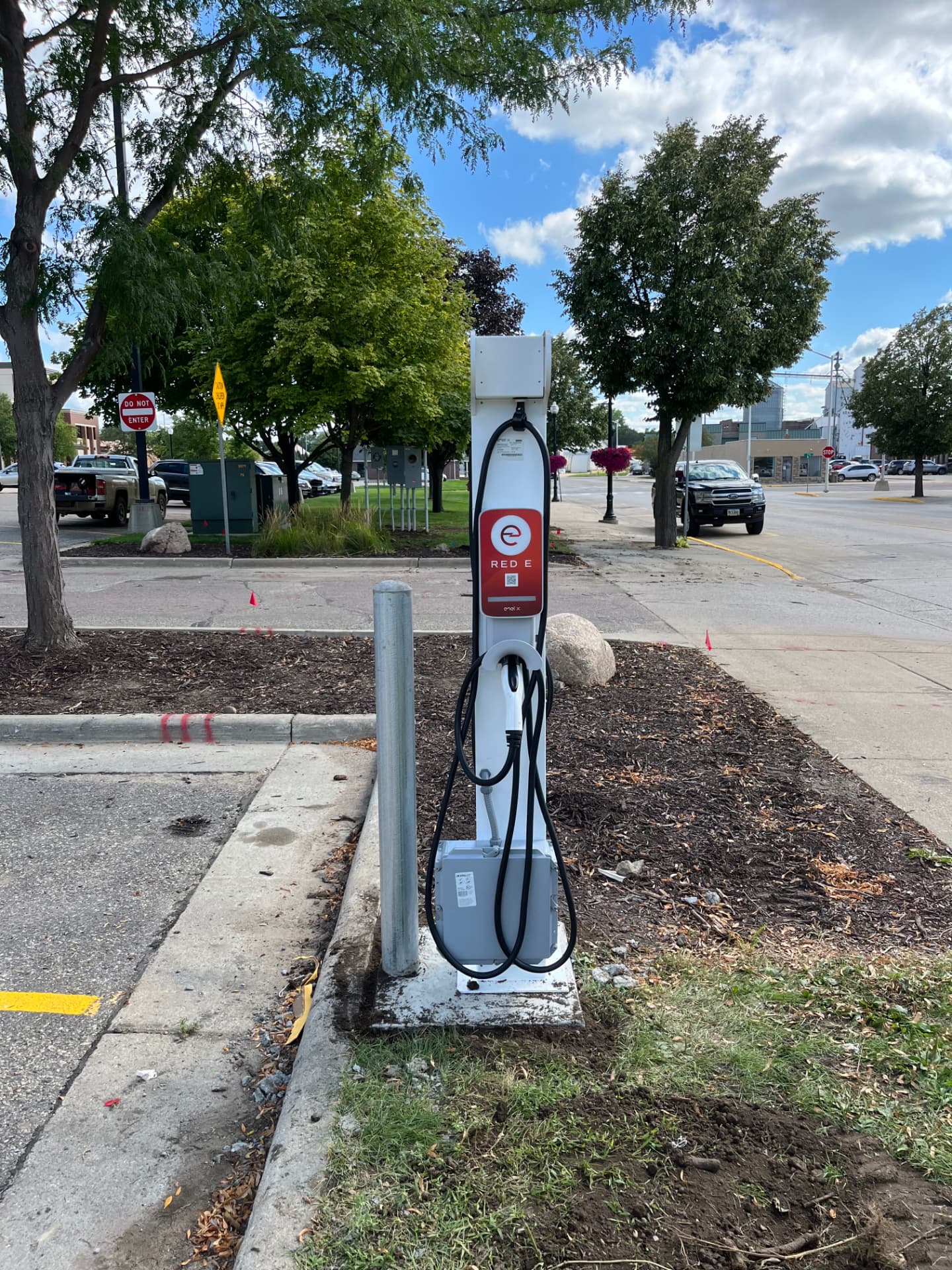 Outdoor electrical equipment beside a parking area