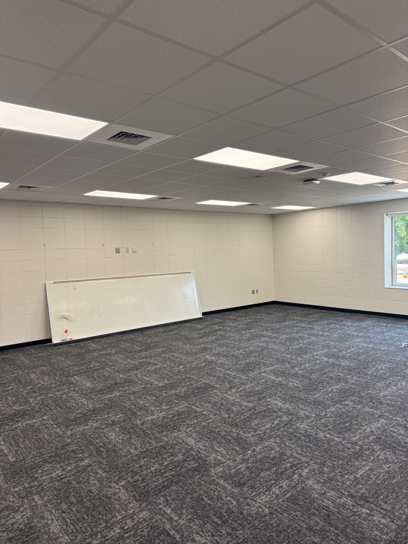 Ceiling lighting in a room with windows